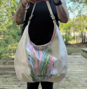 One of a kind handbag made with hand marbled fabric panel in pastel and jewel tones