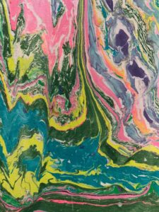 Hand marbled fabric with layered creamsicle technique in pink, green, and purple tones
