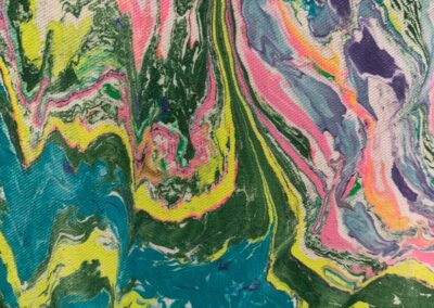 Hand marbled fabric with layered creamsicle technique in pink, green, and purple tones