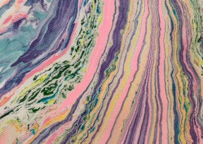 Abstract marbled fabric detail with flowing vertical color movement