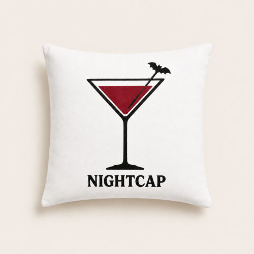 Nightcap Halloween cocktail pillow with red martini and black bat