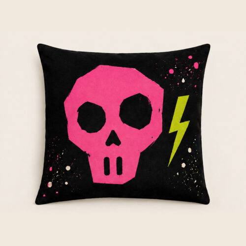 Punk Bones pink skull Halloween pillow on black with green lightning bolt